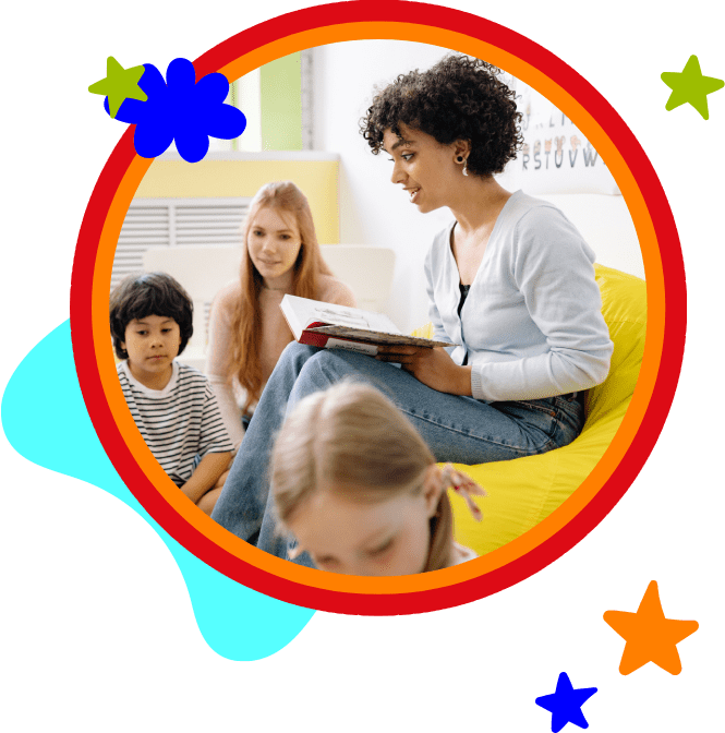 A woman sitting on top of a chair reading to children.